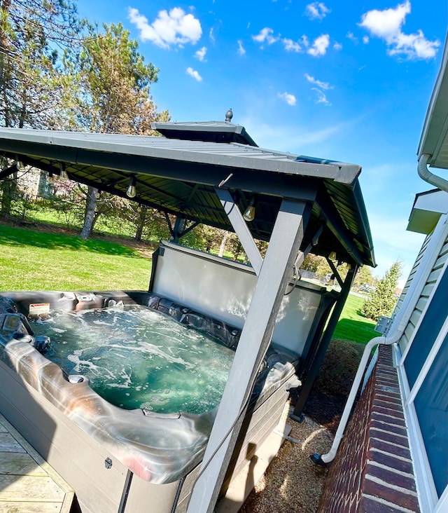 exterior space with a hot tub