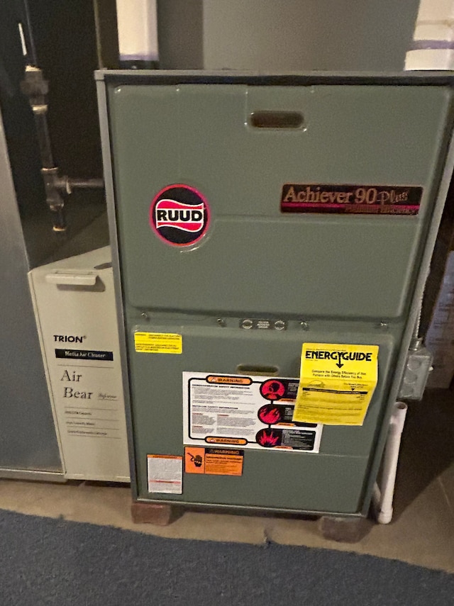 utility room with heating unit