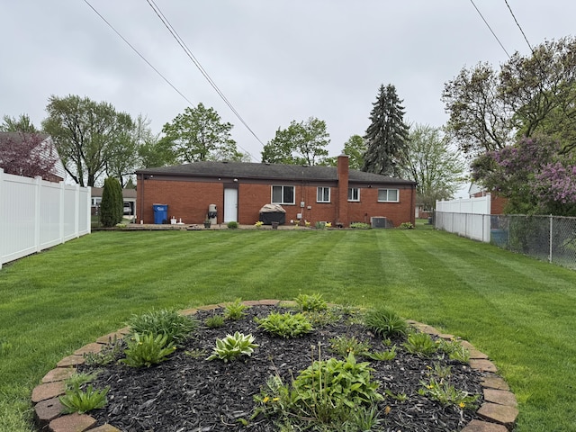 31534 Stricker Dr, Warren, MI 48088 - back of property with brick siding and a chimney