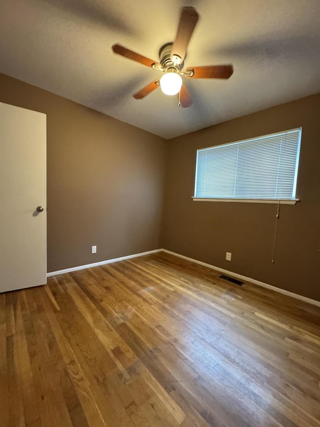 31534 Stricker Dr, Warren, MI 48088 - spare room featuring ceiling fan, wood finished floors, and baseboards