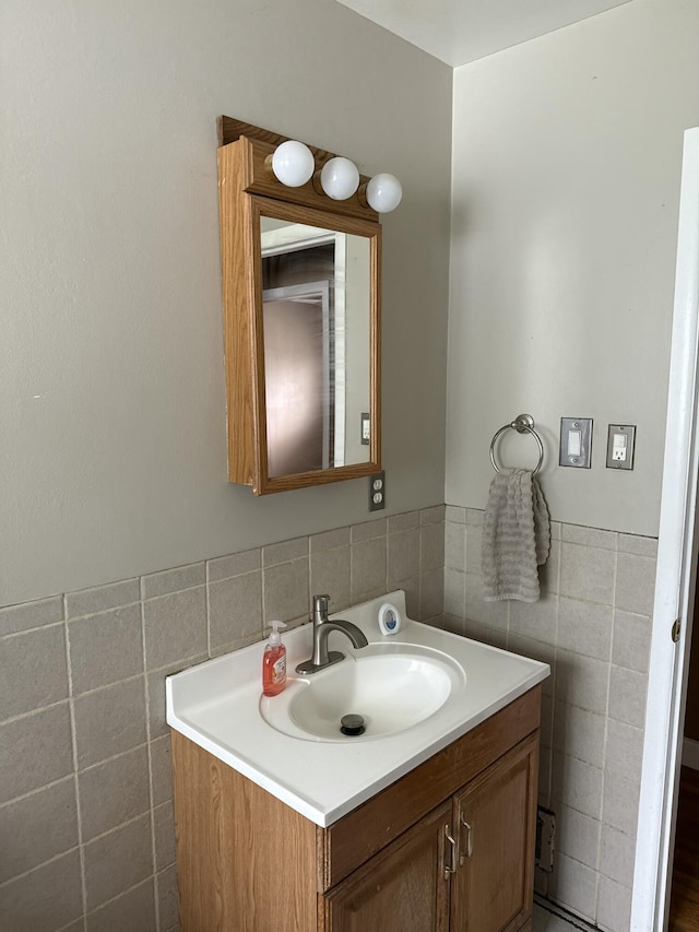 31534 Stricker Dr, Warren, MI 48088 - bathroom with vanity, tile walls, and a wainscoted wall