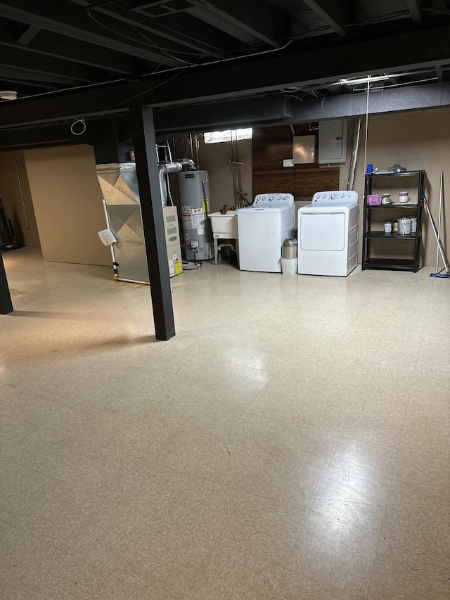31534 Stricker Dr, Warren, MI 48088 - unfinished below grade area featuring independent washer and dryer, water heater, tile patterned floors, and electric panel