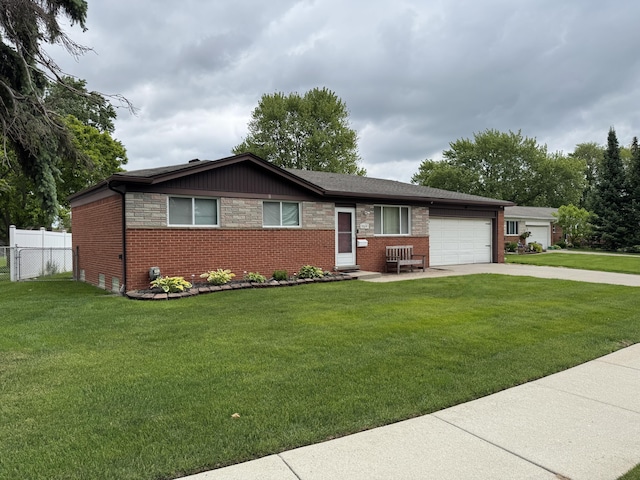 31534 Stricker Dr, Warren, MI 48088 - ranch-style home with concrete driveway, an attached garage, and brick siding