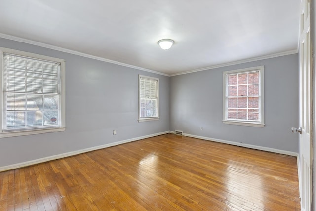 16760 Greenview Ave, Detroit, MI 48219 - spare room with baseboards, hardwood / wood-style floors, and a healthy amount of sunlight