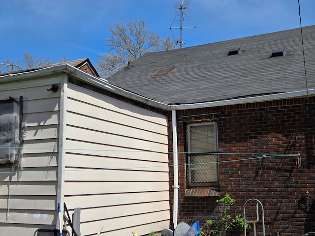 exterior view of brick siding and roof with shingles