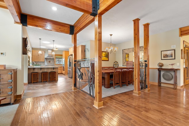 12324 Cranes Ave, Richland, MI 49083 - interior space with recessed lighting, baseboards, a chandelier, light wood-style floors, and ornate columns
