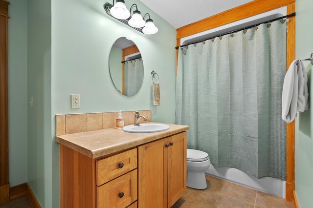 12324 Cranes Ave, Richland, MI 49083 - bathroom with tasteful backsplash, toilet, tile patterned flooring, and vanity