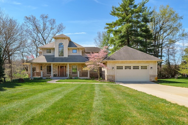 12324 Cranes Ave, Richland, MI 49083 - view of front facade featuring driveway, a front yard, a garage, stone siding, and a porch