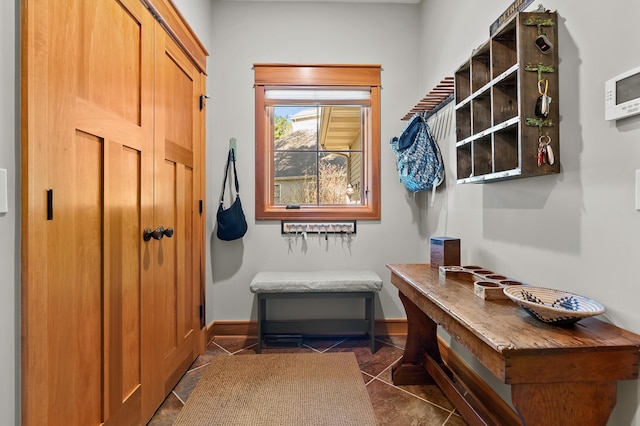 12324 Cranes Ave, Richland, MI 49083 - mudroom featuring dark tile patterned floors and baseboards