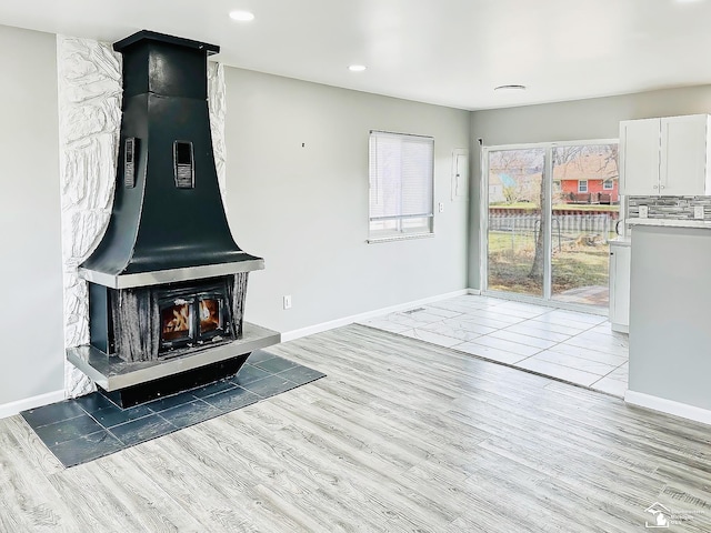35381 Dern Dr, Rockwood, MI 48173 - unfurnished living room with light wood-style floors and baseboards
