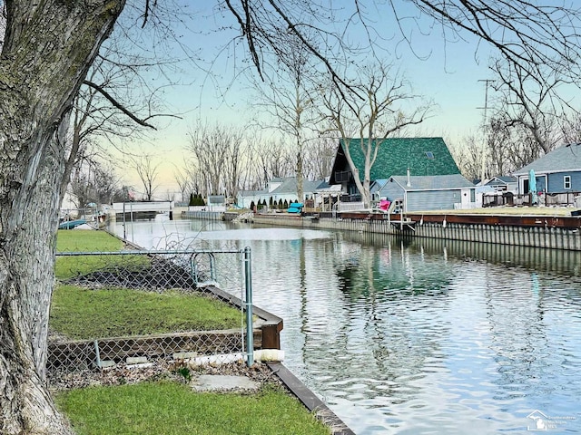35381 Dern Dr, Rockwood, MI 48173 - dock area with a water view and fence