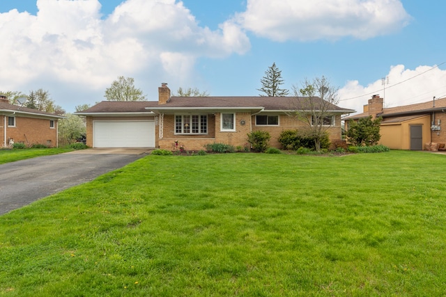3928 Embarcadero St, Waterford, MI 48329 - single story home with asphalt driveway, a chimney, brick siding, a garage, and a front yard
