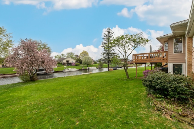 3928 Embarcadero St, Waterford, MI 48329 - view of grassy yard with a deck with water view