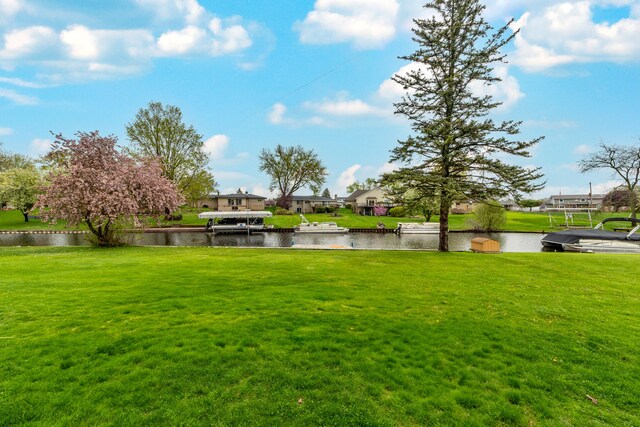 3928 Embarcadero St, Waterford, MI 48329 - view of green lawn featuring a water view and a residential view