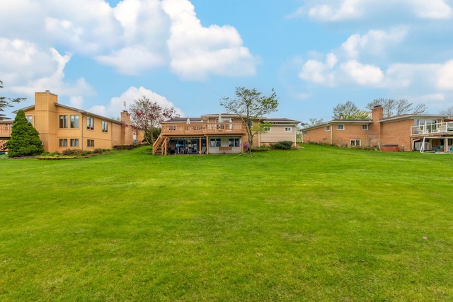 3928 Embarcadero St, Waterford, MI 48329 - rear view of property with a wooden deck, stairs, and a yard