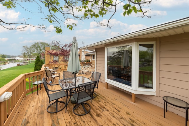 3928 Embarcadero St, Waterford, MI 48329 - wooden terrace with outdoor dining area, a water view, and a lawn