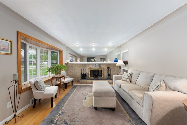 3928 Embarcadero St, Waterford, MI 48329 - living room with wood finished floors, a fireplace, and baseboards