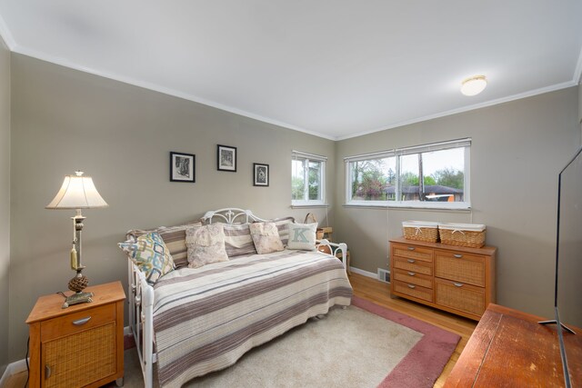 3928 Embarcadero St, Waterford, MI 48329 - bedroom featuring ornamental molding, wood finished floors, and baseboards
