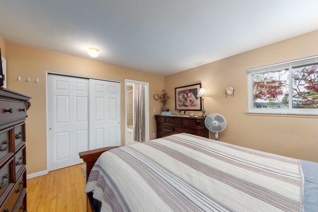 3928 Embarcadero St, Waterford, MI 48329 - bedroom with a closet, light wood finished floors, and baseboards
