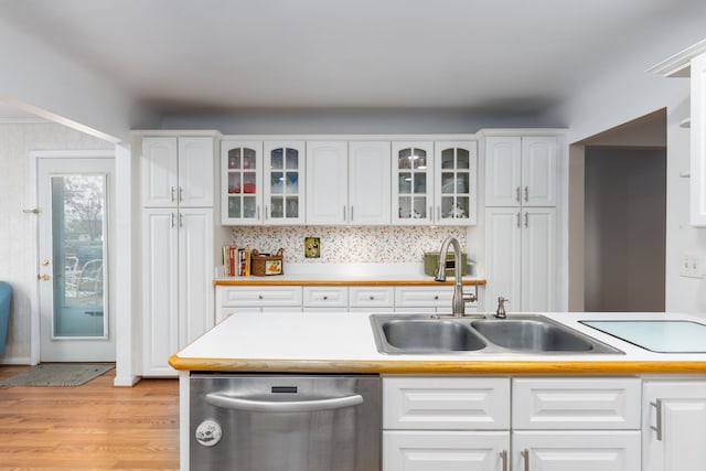 3928 Embarcadero St, Waterford, MI 48329 - kitchen featuring stainless steel dishwasher, a sink, white cabinetry, and light wood-style flooring