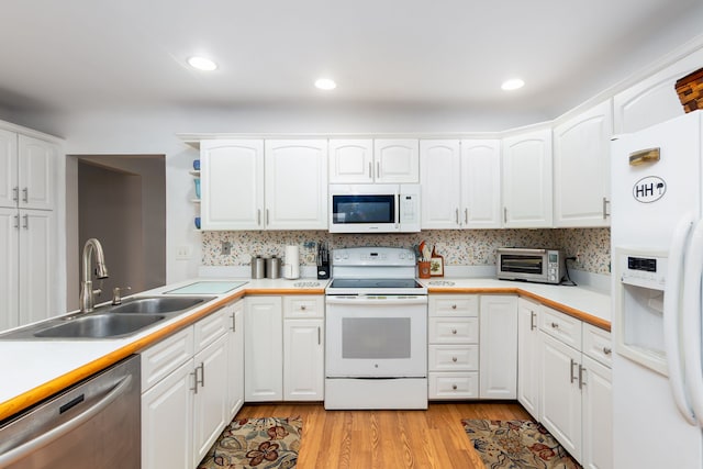3928 Embarcadero St, Waterford, MI 48329 - kitchen with white appliances, a sink, light wood-style flooring, white cabinets, and light countertops