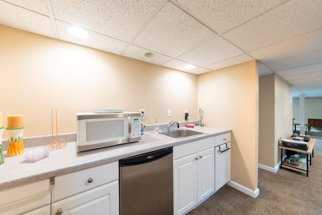 3928 Embarcadero St, Waterford, MI 48329 - kitchen featuring white microwave, dishwashing machine, a sink, dark colored carpet, and light countertops