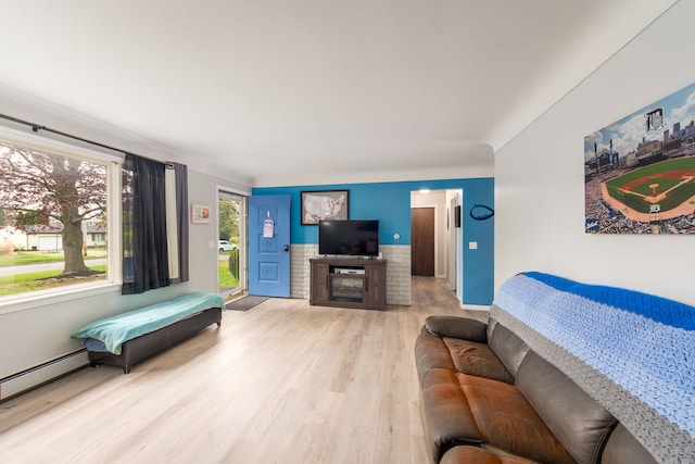 living room featuring light wood-style floors and baseboard heating