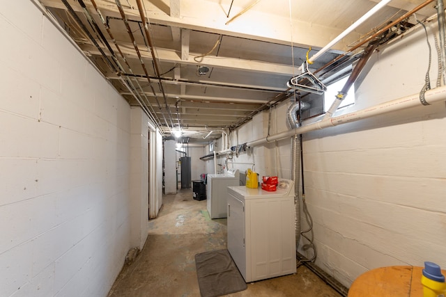 unfinished below grade area featuring washer and dryer and concrete block wall