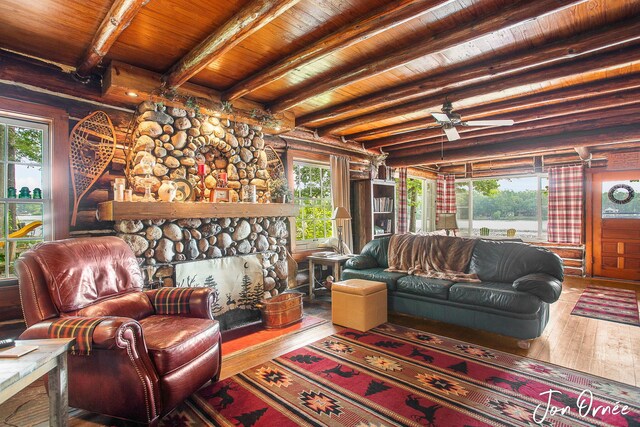 living room featuring ceiling fan, wooden ceiling, beamed ceiling, and hardwood / wood-style floors