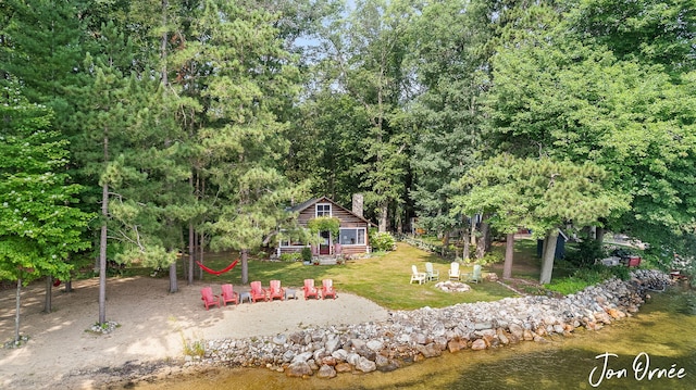 view of yard with a fire pit and an outbuilding
