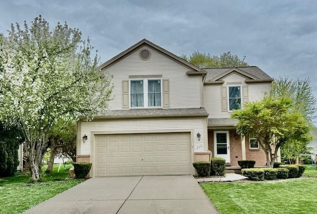 traditional-style house with a front lawn, driveway, brick siding, and an attached garage