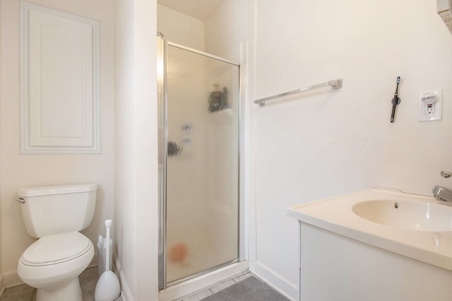full bath featuring tile patterned floors, vanity, toilet, and a shower stall