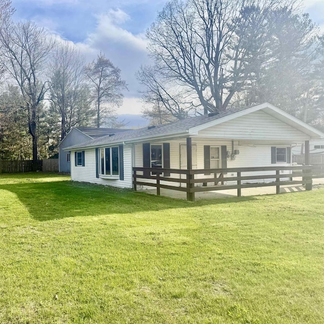 2905 W Burt Rd, Montrose, MI 48457 - back of house featuring a yard, a shingled roof, and fence