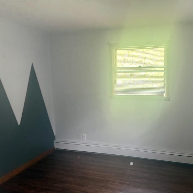 2905 W Burt Rd, Montrose, MI 48457 - empty room with baseboards and dark wood-type flooring