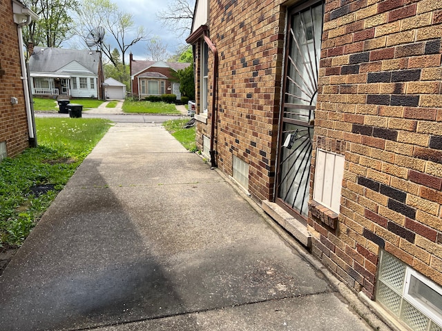 view of property exterior featuring brick siding