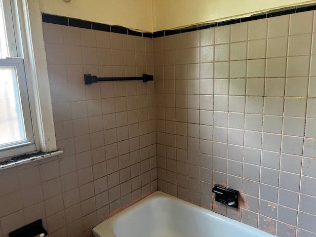 full bath featuring  shower combination