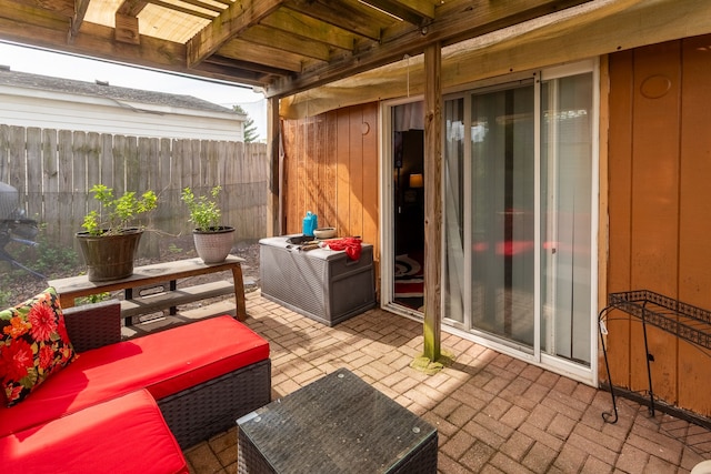 view of patio / terrace featuring fence and outdoor lounge area