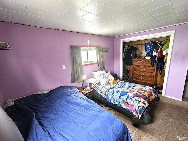 carpeted bedroom with a closet