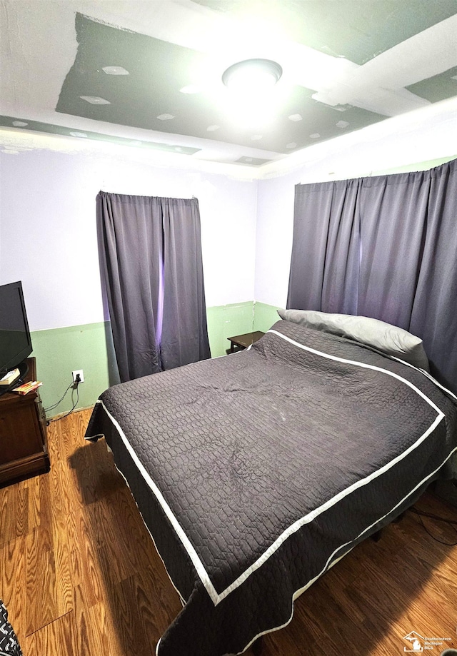 bedroom featuring wood finished floors