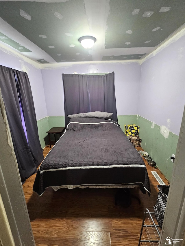 bedroom with wood finished floors