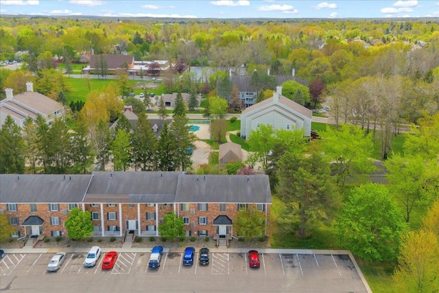 bird's eye view featuring a wooded view