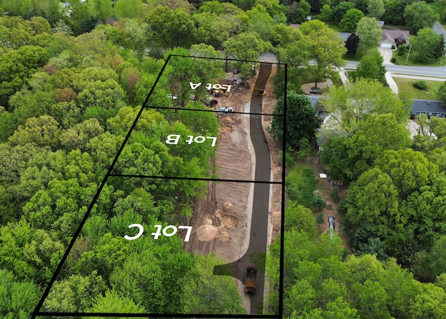 2395 Dunnigan Ave NE Unit C, Grand Rapids, MI 49525 - aerial view of property and surrounding area featuring property parcel outlined and a forest