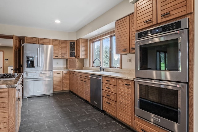 3101 Delano Rd, Oxford, MI 48371 - kitchen with stainless steel appliances, a sink, glass insert cabinets, recessed lighting, and light countertops