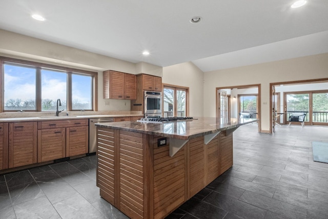 3101 Delano Rd, Oxford, MI 48371 - kitchen featuring a sink, appliances with stainless steel finishes, brown cabinets, recessed lighting, and a kitchen island