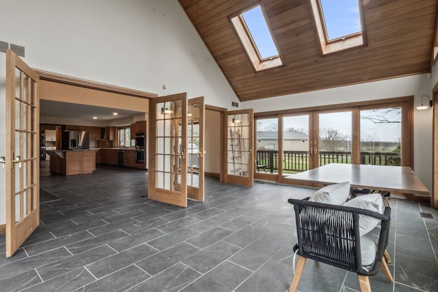 3101 Delano Rd, Oxford, MI 48371 - living room with french doors, high vaulted ceiling, wooden ceiling, and a skylight