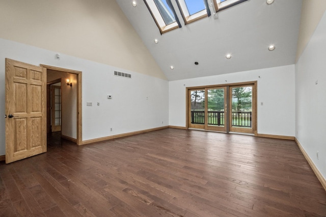 3101 Delano Rd, Oxford, MI 48371 - spare room featuring high vaulted ceiling, a skylight, dark wood-style floors, recessed lighting, and baseboards