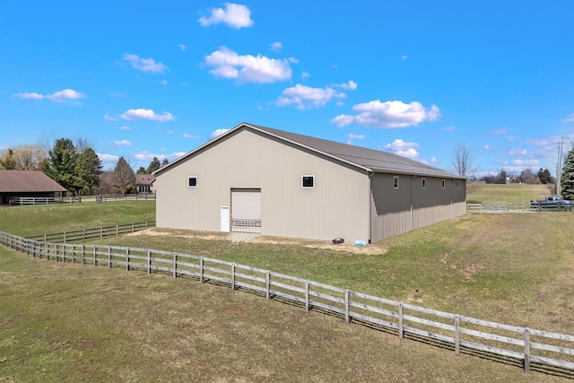 3101 Delano Rd, Oxford, MI 48371 - view of side of home with a garage, an outbuilding, fence, and a lawn