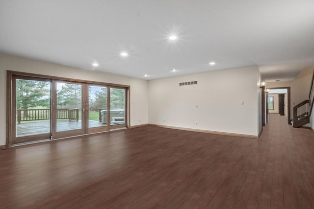 3101 Delano Rd, Oxford, MI 48371 - unfurnished living room featuring dark wood-type flooring, recessed lighting, and baseboards
