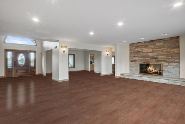 3101 Delano Rd, Oxford, MI 48371 - unfurnished living room with wood finished floors, a fireplace, baseboards, and recessed lighting