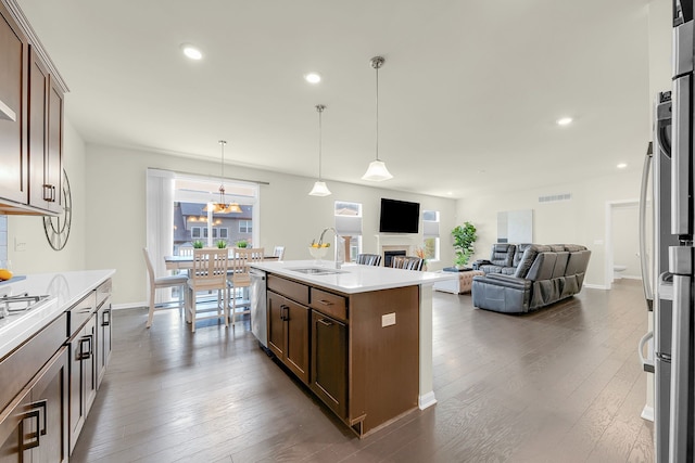 43547 Bolingbrooke Ln, Novi, MI 48377 - kitchen featuring a sink, light countertops, dark wood-style flooring, and recessed lighting